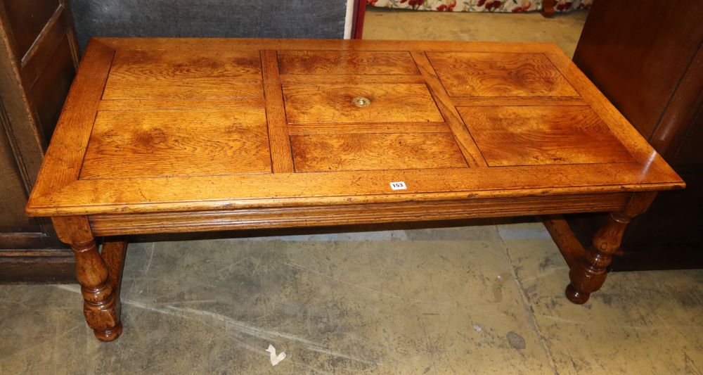 An 18th century style rectangular oak coffee table with central box compartment, W.140cm, D.70cm, H.48cm